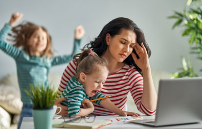 Stressed-out mom with two screaming kids